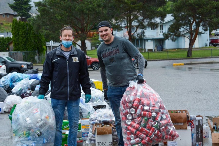 <who> Photo Credit: West Kelowna Warriors </who> Chris Laurie, on left, and broadcaster Chase Johnston help during a bottle drive fundraiser.