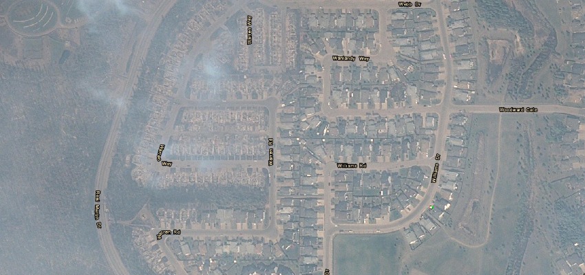 <who> Photo Credit: Alberta Government </who> A satellite image of Fort McMurray is available for resident to survey the damage to their community. 