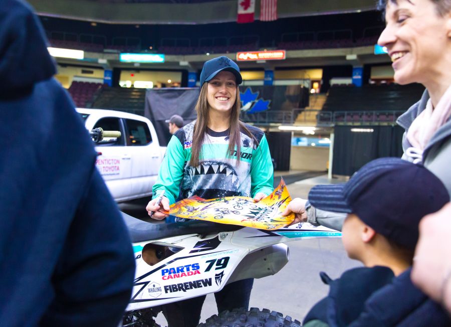 <who>Photo Credit: NowMedia</who>Kassie Boone hung out with fans and signed autographs at the pre-event Pit Party.