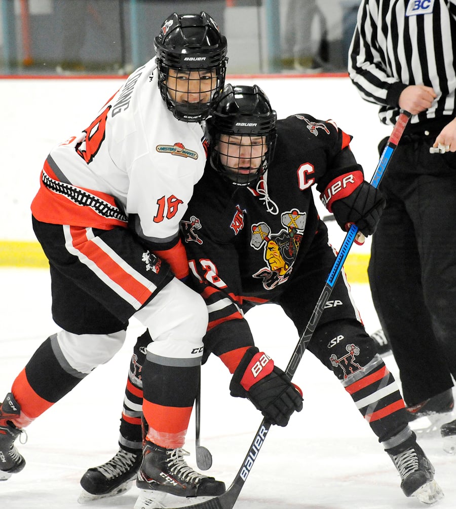 Myles Mattila of the Chiefs and the Steam's Cory Loring shoulder to shoulder in front of the Summerland net in the first period.