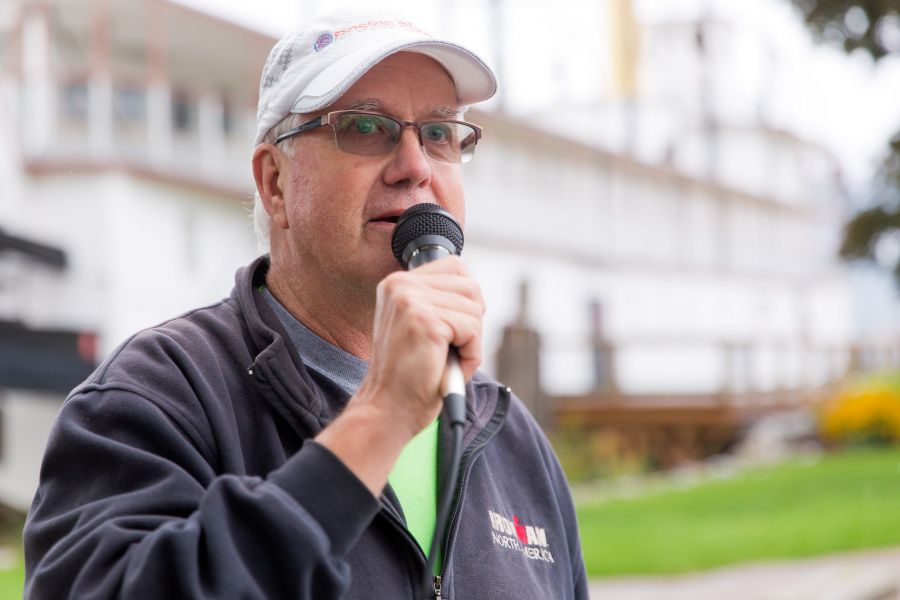 <who>Photo Credit: NowMedia</who> Veteran race announcer Dave Bullock at the mic