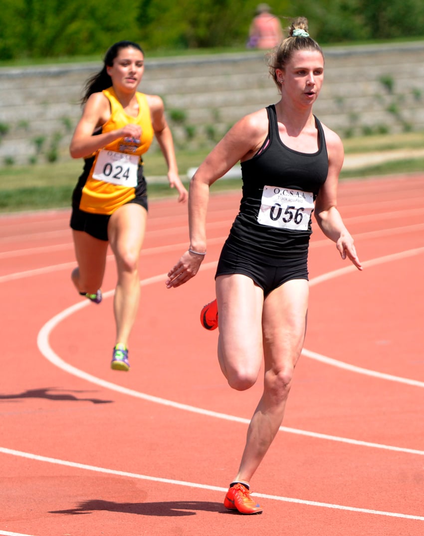 <who>Photo Credit: Lorne White/KelownaNow </who>Bryn Walsh, right, of the KSS Owls ran and vaulted to two Okanagan records in Kamloops.