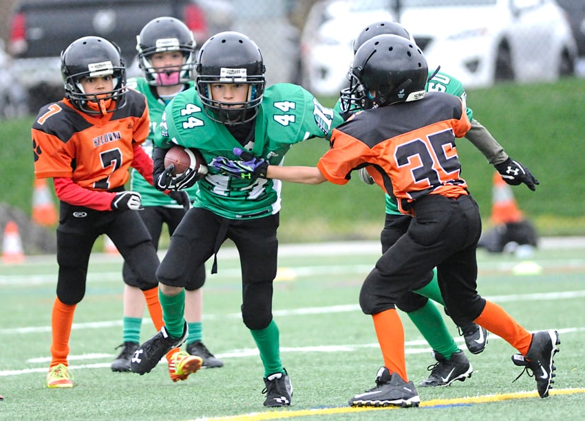 <who>Photo Credit: Lorne White/KelownaNow </who>Brady Shultz (44) of the Kelowna Riders finds a hole in the first half of their 22-0 atom win over the Kelowna Lions. 