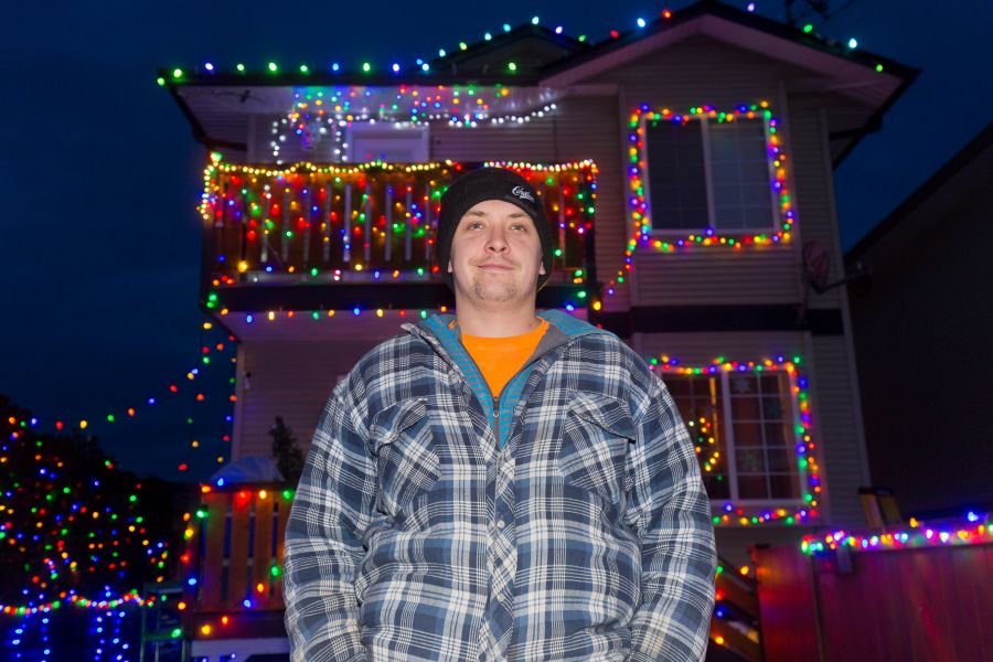 <who>Photo Credit: NowMedia</who> Christmas light fanatic Matt Adam in front of his masterpiece
