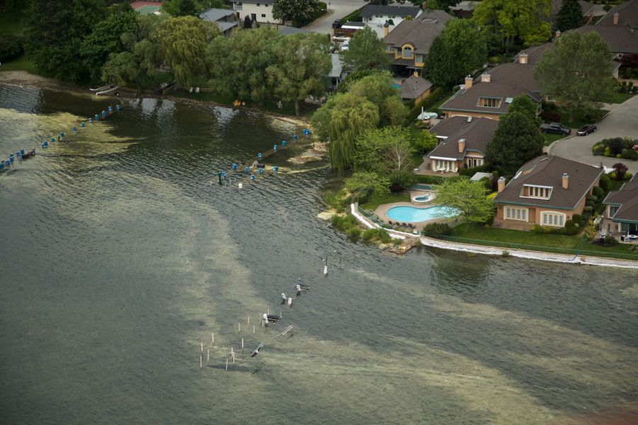 <who> Photo Credit: KelownaNow. </who> Most docks in the Lower Mission are submerged.