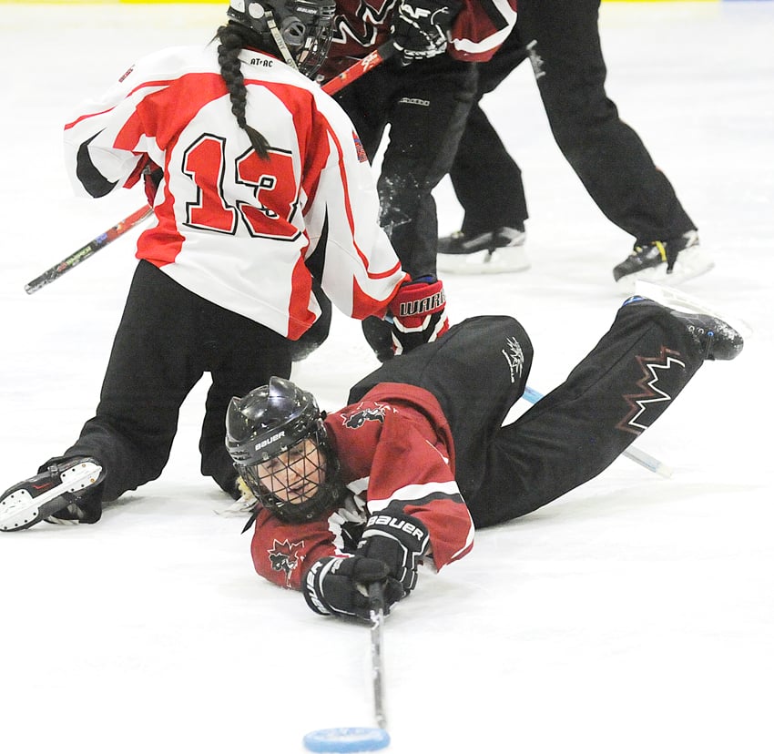 <who>Photo Credit: Lorne White/KelownaNow </who>Kaitlynn Penny of the Kelowna Adrenaline stretches to retrieve a loose ring in the U16B Sweetheart final on Sunday.