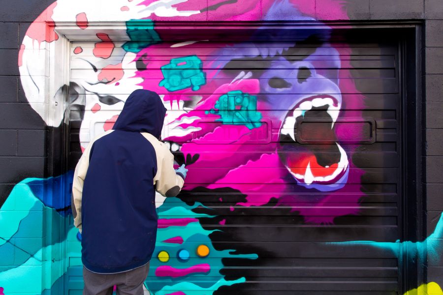 <who>Photo Credit: NowMedia</who> Mulherin painting the door to his Matheson & Grove studio