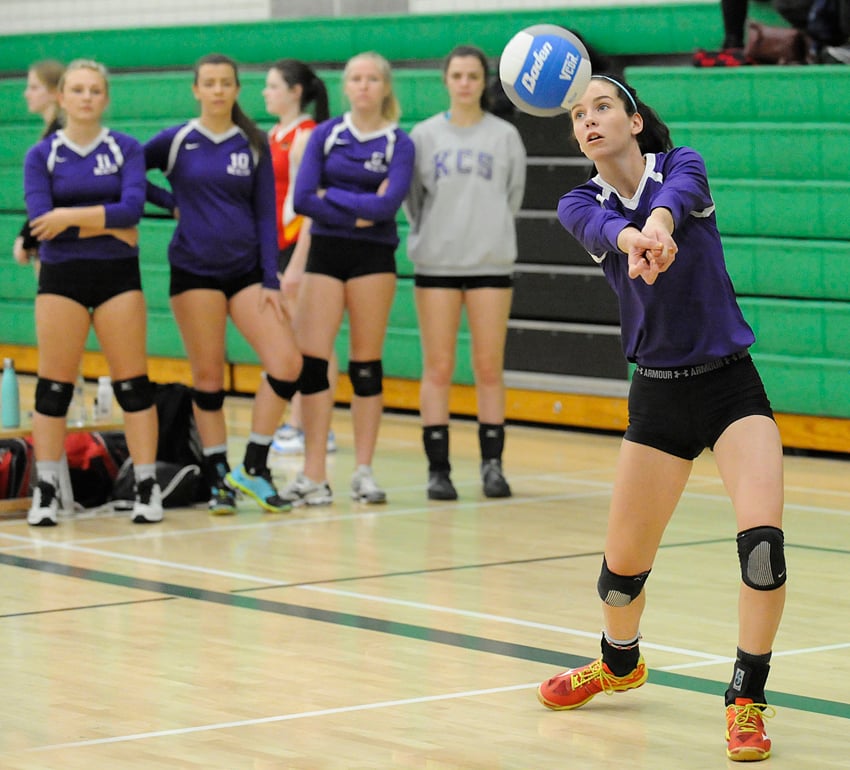<who>Photo Credit: Lorne White/KelownaNow </who>Taysha Boulter, right, of the KCS handles a pass against the G.W. Graham Grizzlies of Chilliwack. In the background are Knight teammates, from left, Madi Martens, Maggie Becker, Abby Heinen and Mackayla Sader.