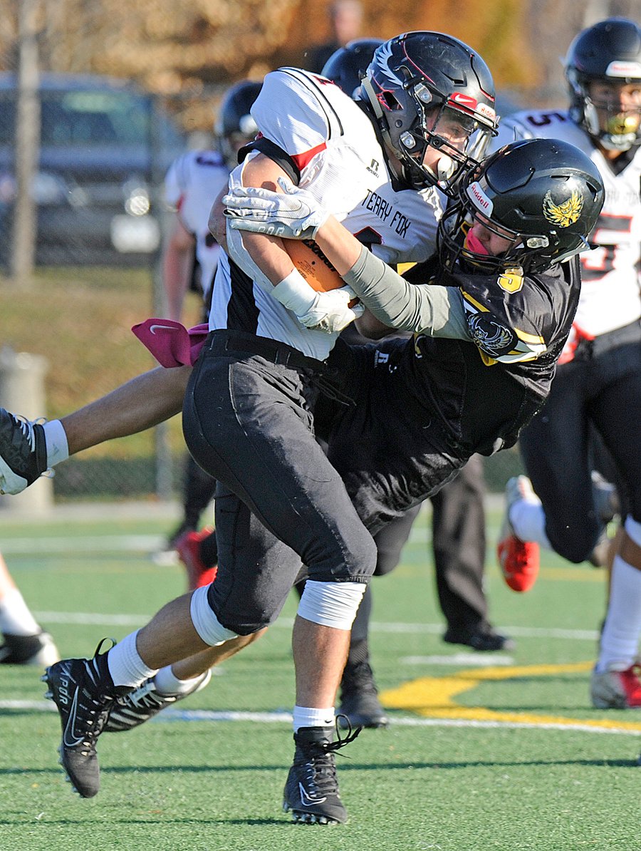 <who>Photo Credit: Lorne White/KelownaNow </who>Chase Hunter in on another tackle for the JV KSS Owls.