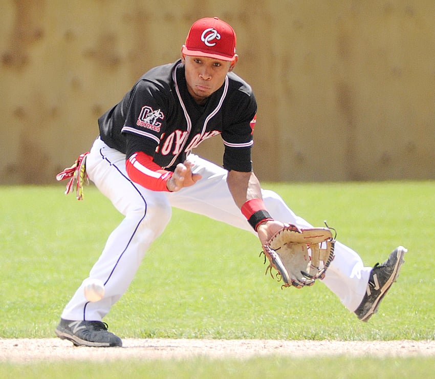 <who>Photo Credit: Lorne White/KelownaNow </who>OC shortstop Erik Junnola prepares to scoop up a ground ball in the second inning of their final round-robin game against the U of C Dinos. Junnola collected two hits in an 11-1 win.