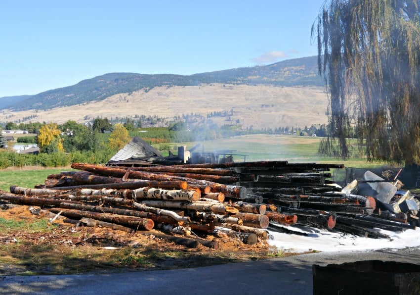 <who> Photo Credit: KelownaNow.com </who> Sawdust associated with Keuker's sale of firewood contributed to the speed with which flames spread.