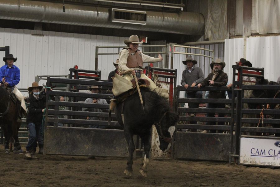<who> Photo Credit: Olds College </who> Cooper on a horse during the saddle bronc event.