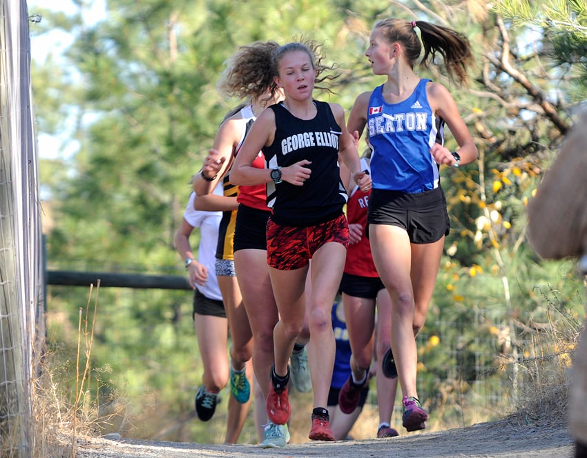 <who>Photo Credit: Lorne White/KelownaNow </who>Taryn O'Neill, left, held the lead for the entire the senior girls' 4.9-kilometre race in Summerland.