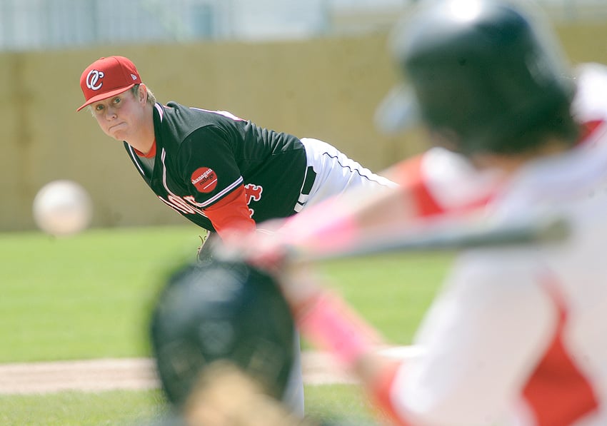 <who>Photo Credit: Lorne White/KelownaNow </who>Bo Meiklejohn of the OC Coyotes delivers to a U of C Dino in Saturday's final round-robin game at the CCBC championship tournament. Meiklejohn was the winning pitcher, scattering four hits over six innings.