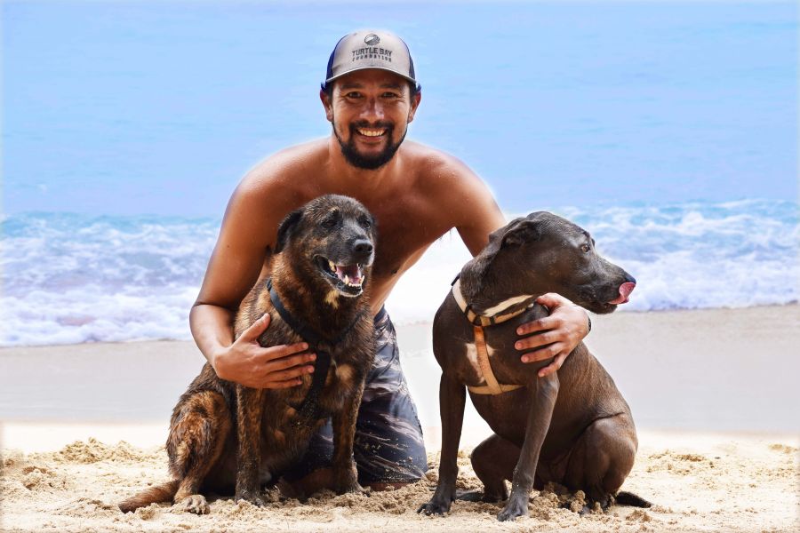 </who>Rocky Canon of Hawaii Surf Dogs with his business partners Kahuna, left, and Hina.