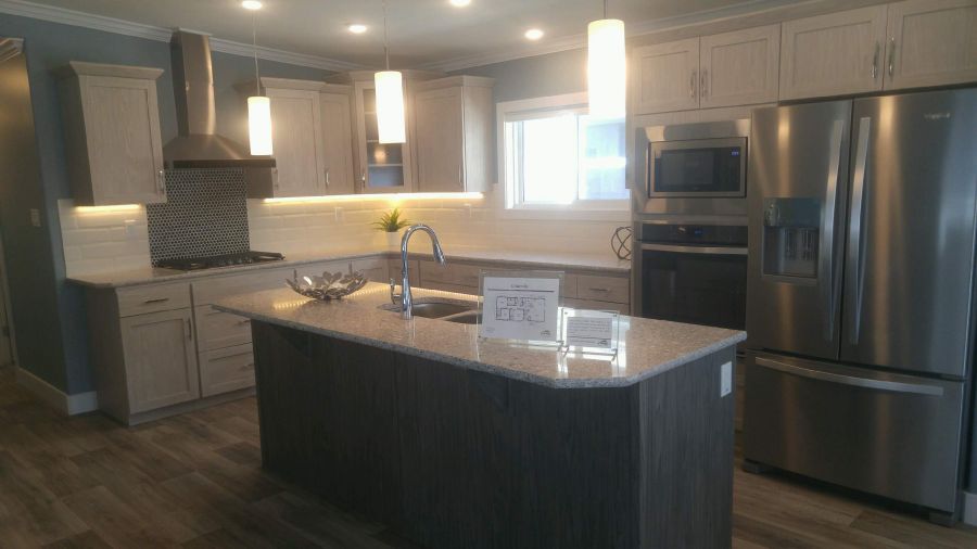 <who>Photo Credit: PentictonNow </who>Metric Modular in Penticton mades these beautiful modular homes, which are being sold by Jandel Homes Ltd., which is located directly beside the Metric Modular plant on Government Street in Penticton.