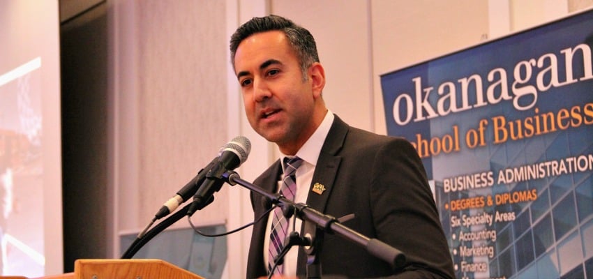 <who> Photo Credit: KelownaNow.com </who> Mayor Basran speaking at the state of the city address.
