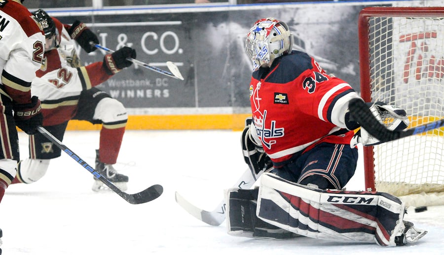 <who>Photo Credit: Lorne White/KelownaNow </who>Parm Dhaliwal scores the Warriors' second goal, beating Jack Grant, who was replaced after giving up five..