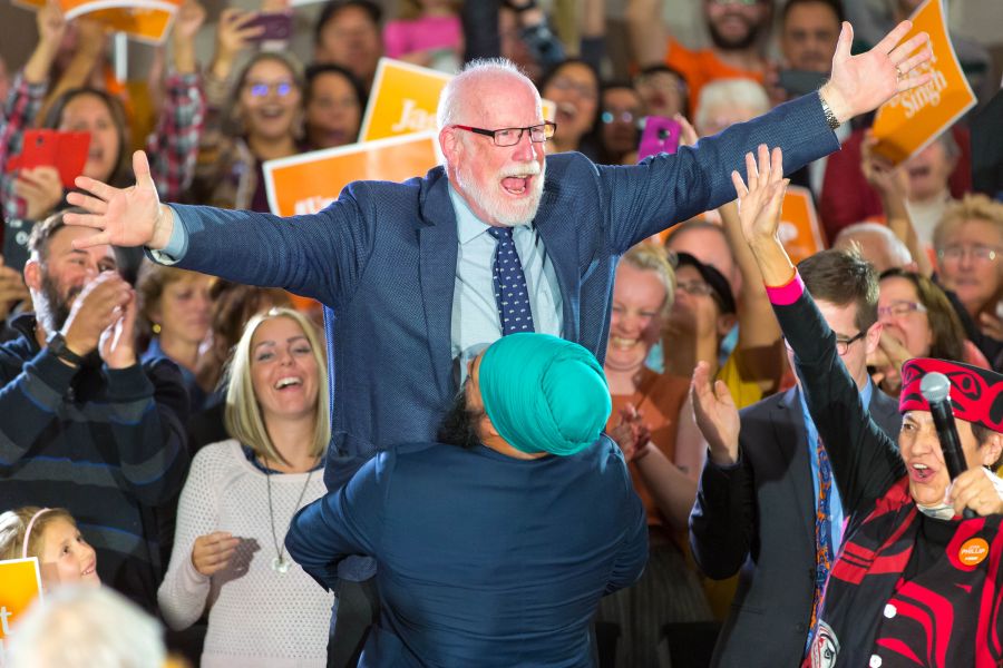 <who>Photo Credit: NowMedia/Gord Goble</who> Hoisted at rally by Jagmeet Singh