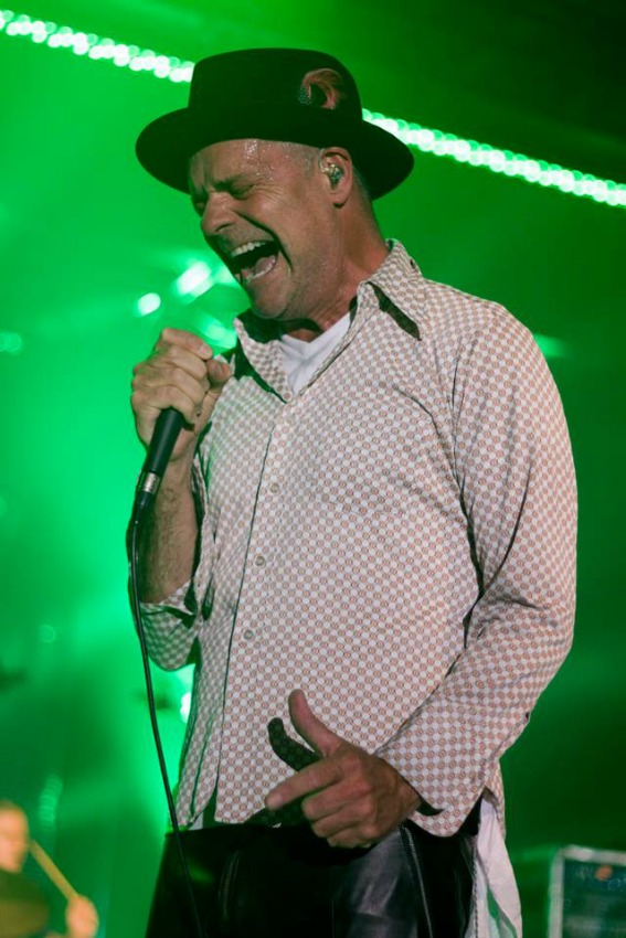 <who> Photo Credit: The Tragically Hip on Facebook. </who> Gord Downie performing with the band in Ontario in 2015. 