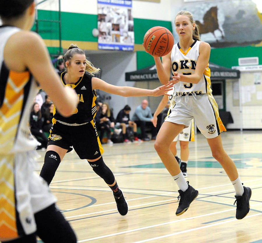 <who>Photo Credit: Lorne White/KelownaNow </who>Tatum Wade, right, of the OKM Huskies was selected as a tournament all-star along the KSS Owls' Tessa Bentley, left.