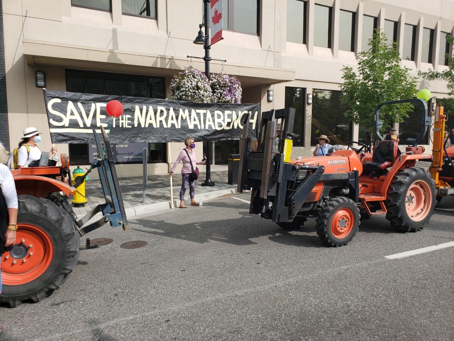 <who> Photo Credit: NowMedia </who> Tractors from Naramata Bench line street in front of Penticton City Hall.