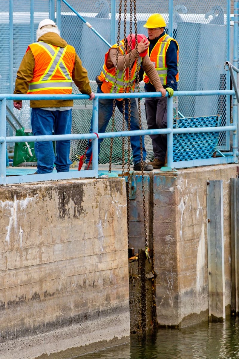 <who>Photo Credit: NowMedia</who> A second board is removed from the top gate of the fish ladder