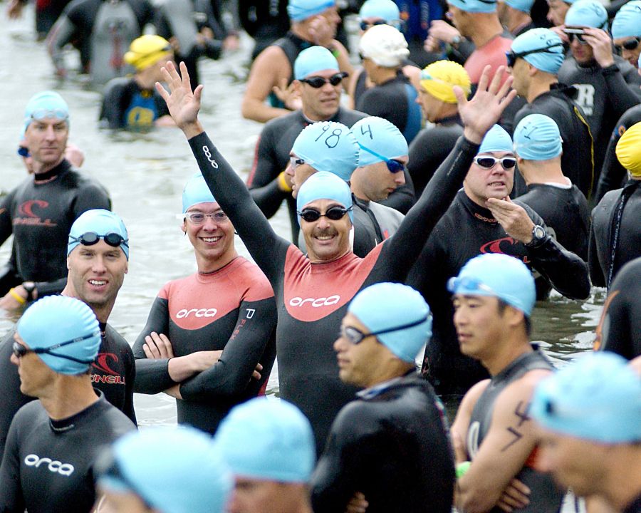 <who>Photo Credit: Lorne White/KelownaNow </who>Mike Cambridge of Kelowna and Eric Simpson (raised arms) of West Kelowna get set for the 2005 Oliver Half Iron. Cambridge finished fourth overall and first in the 19-24 age category while Simpson, competing in the 40-44 age group, placed seventh overall.