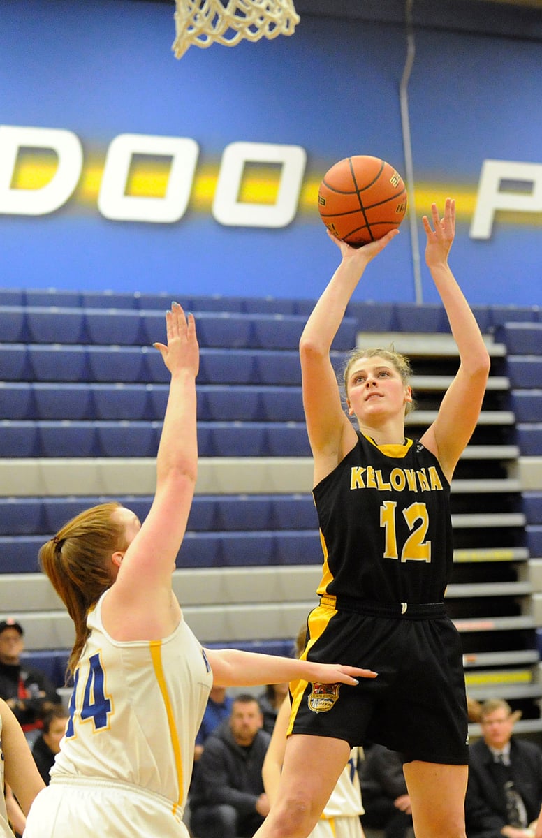 <who>Photo Credit: Lorne White/KelownaNow </who>Kennedy Dickie scored 18 points for the KSS Owls in their lopsided win over Rutland.