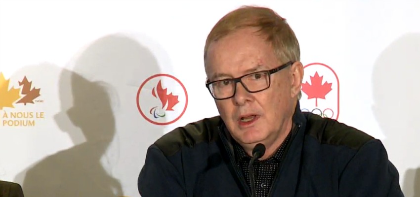 <who> Photo Credit: Screen Grab/ ViaSport </who> John Furlong, chair of Own the Podium, speaks at a press conference Friday. 
