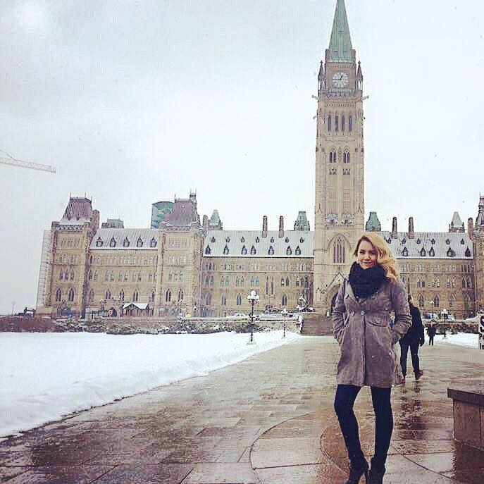 <who> Photo Credit: Nikki Fraser </who> Nikki Fraser standing outside in Parliament Hill in Ottawa.