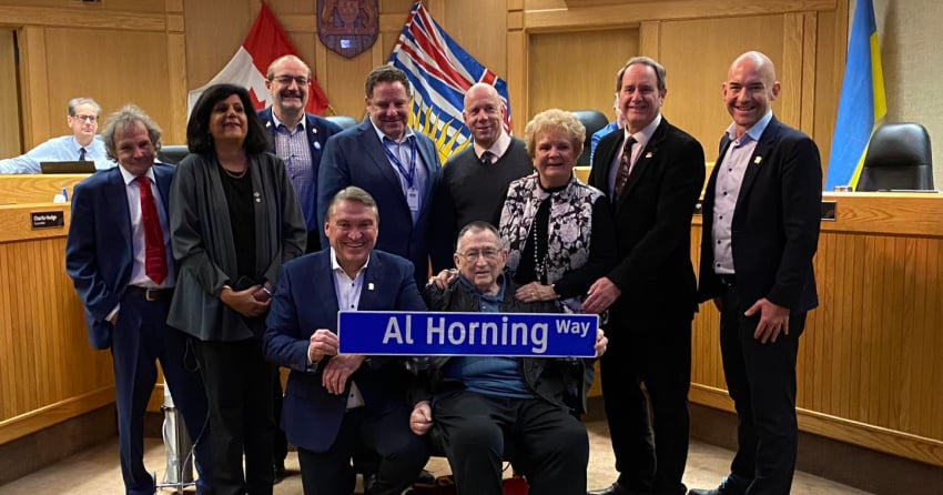 <who> Photo Credit: City of Kelowna </who> Earlier this year, mayor Dyas announced that the city would be naming a future road after Horning to recognize and honour his contributions to both the airport and Rutland.