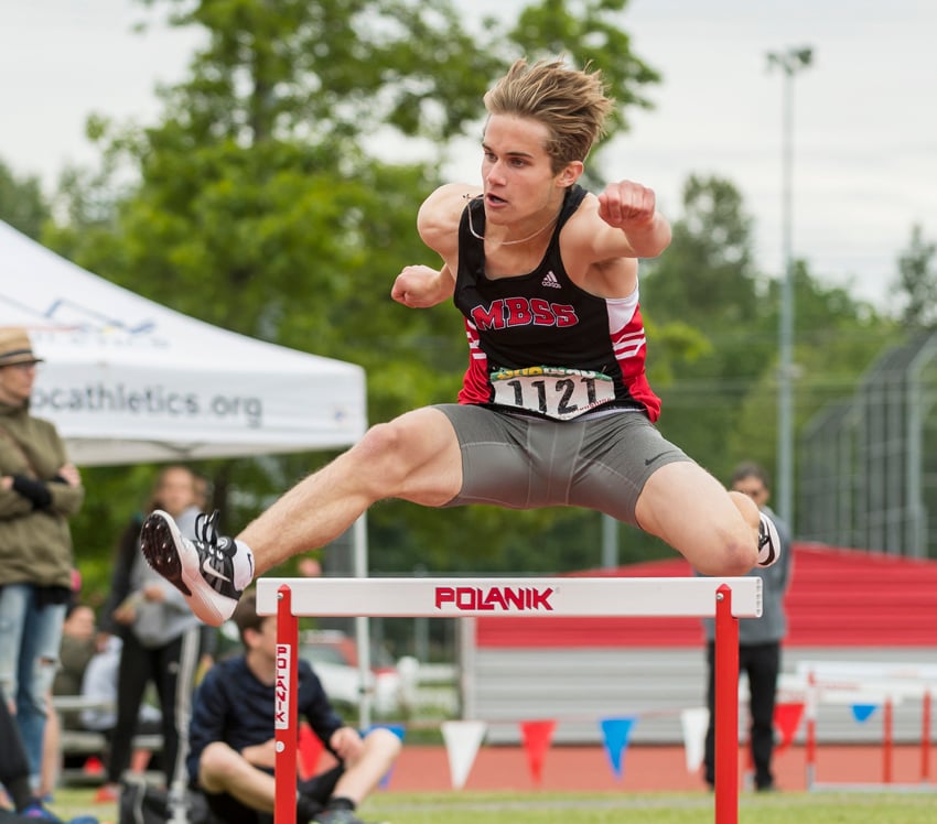 <who>Photo Credit: Wilson Wong/UBC Thunderbirds </who>Mt. Boucherie's Noah Russell hurdled to gold and silver at 50th annual B.C. championships.