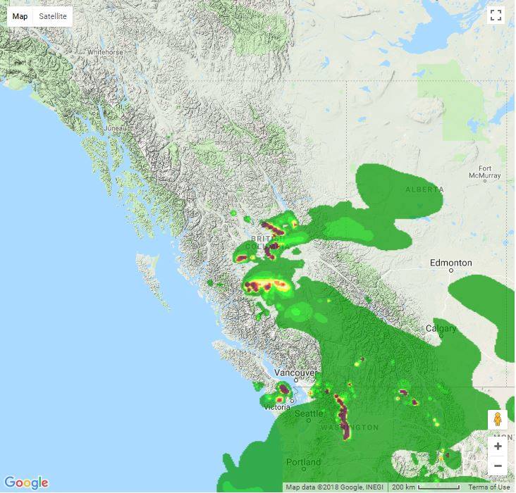 <who> Photo Credit: Firesmoke.ca </who> The green areas indicate moderate smoke with the deep purple showing heavy smoke coverage.