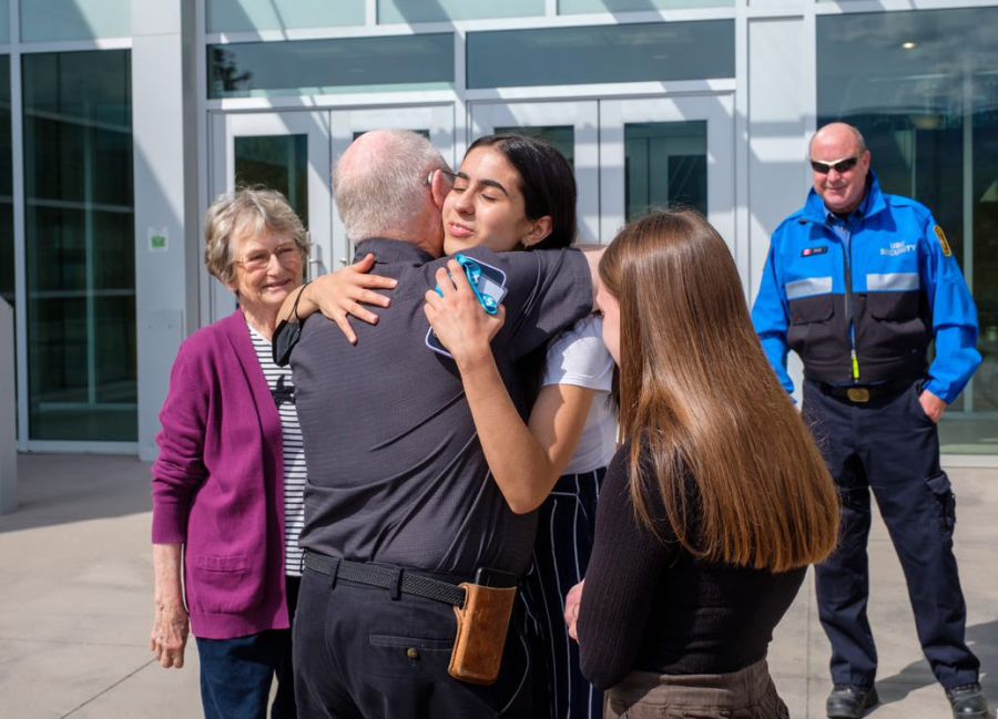 </who>Photo credit: UBCO | UBCO student Kim Davarani hugs heart attack victim Murray Forbes.