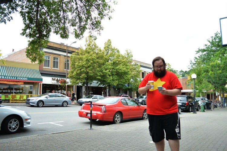<who> Photo Credit: KamloopsBCNow </who> Justin Hay playing Pokémon Go in downtown Kamloops.