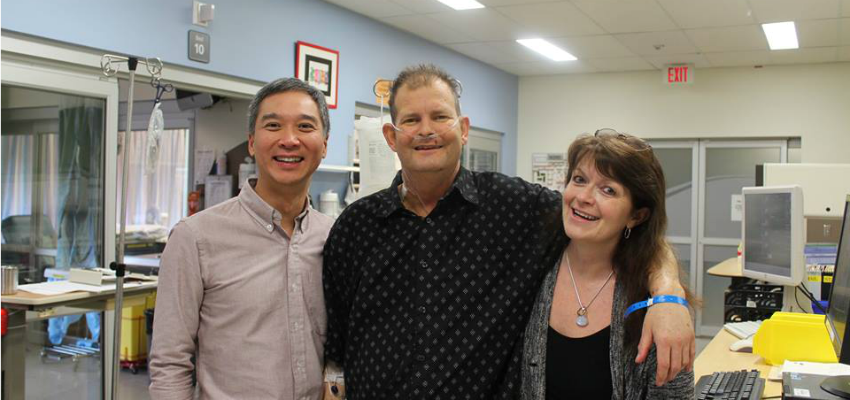 <who> Photo Credit: Michael Garding on Facebook. </who> Michael and wife Val with Dr. Anson Cheung, who performed the surgery