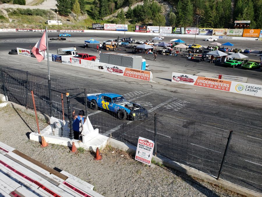 <who>Photo Credit:Dale Cory</who>Ellie Dunseith crossing the start/finish line at Penticton Speedway.