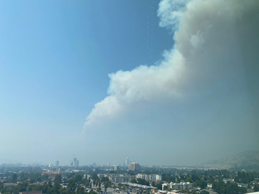 <who>Photo Credit: NowMedia</who>Enough of the lingering smoke dissipated early Thursday afternoon to reveal the large plume of smoke rising from the McDougall Creek wildfire.