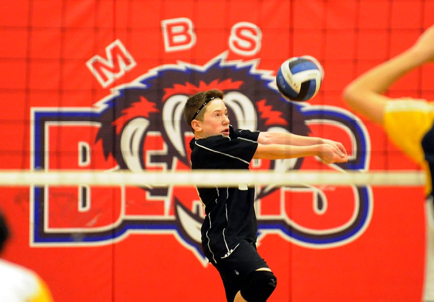 <who>Photo Credit: Lorne White/KelownaNow </who>Libero Brandon Frechette of the GESS Coyotes receives a MEI serve in their provincial semifinal match.