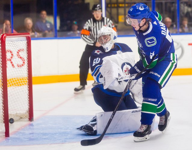 <who>Photo Credit: NowMedia </who>Vancouver Canucks top prospect Jonathan Dahlen scores a beautiful goal against the Winnipeg Jets in the Young Stars Classic this past weekend at the SOEC in Penticton.