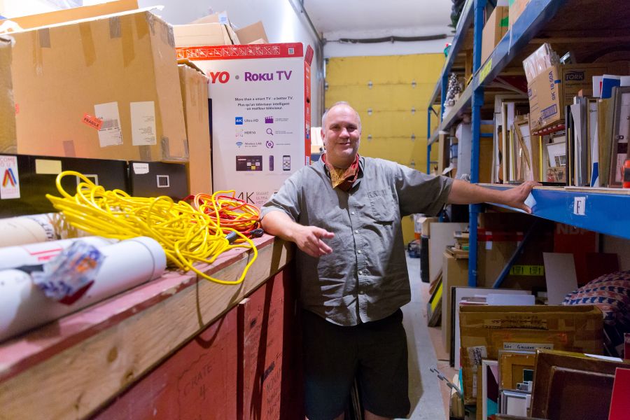 <who>Photo Credit: NowMedia</who> Paul Crawford, surrounded by material for the next show, opening Sept. 18