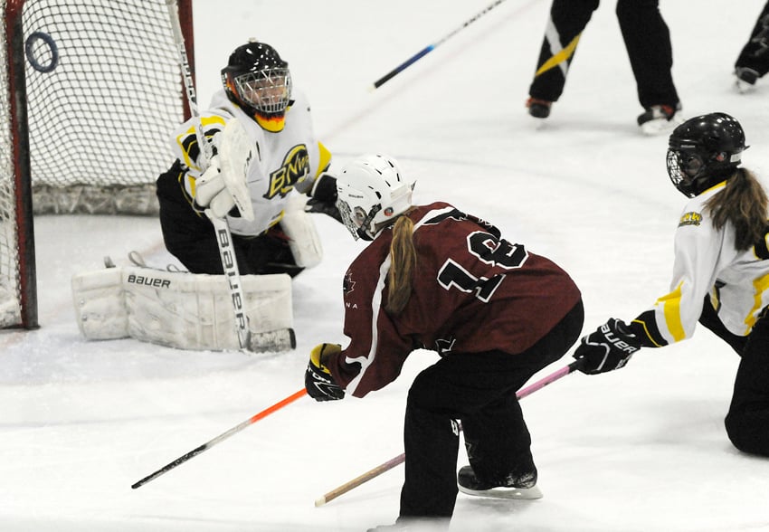 <who>Photo Credit: KelownaNow </who>Emily Stewart of the Kelowna Elite scores against Burnaby in a U16A round-robin game. Stewart and her Elite teammates went on to win gold with a victory over Delta.