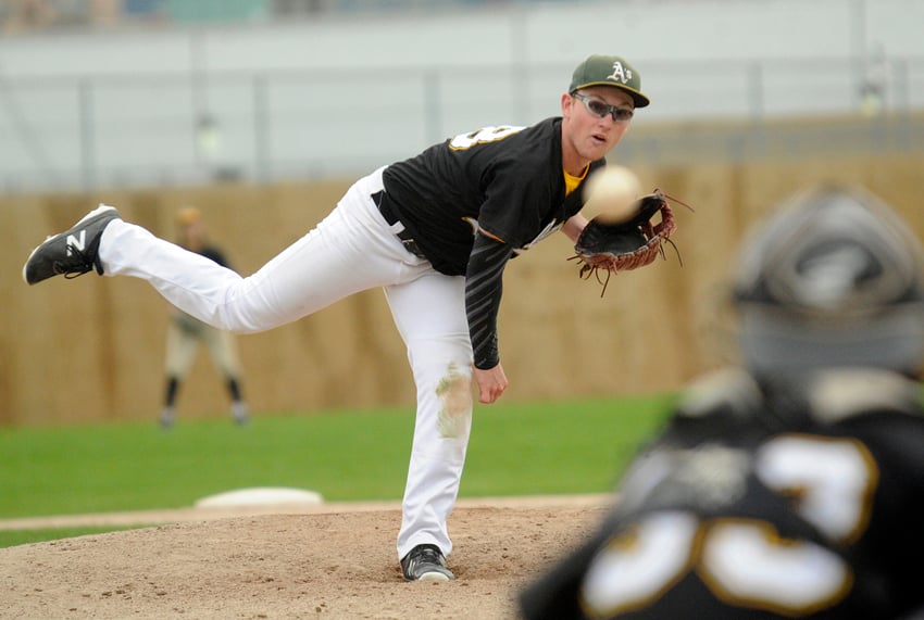 <who>Photo Credit: Lorne White/KelownaNow </who>Chase Batchelor delivers a strike during his one inning of relief in the Athletics' weekend opener.