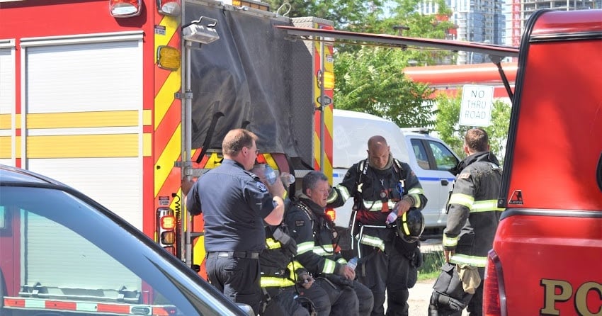 <who> Photo Credit: KelownaNow/Steve MacNaull </who> Firefighters have a rest after knocking down the blaze at 756 Saucier Ave.