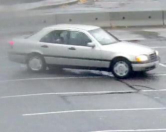 <who> Submitted </who> This beige four-door Mercedes is associated with the person of interest
