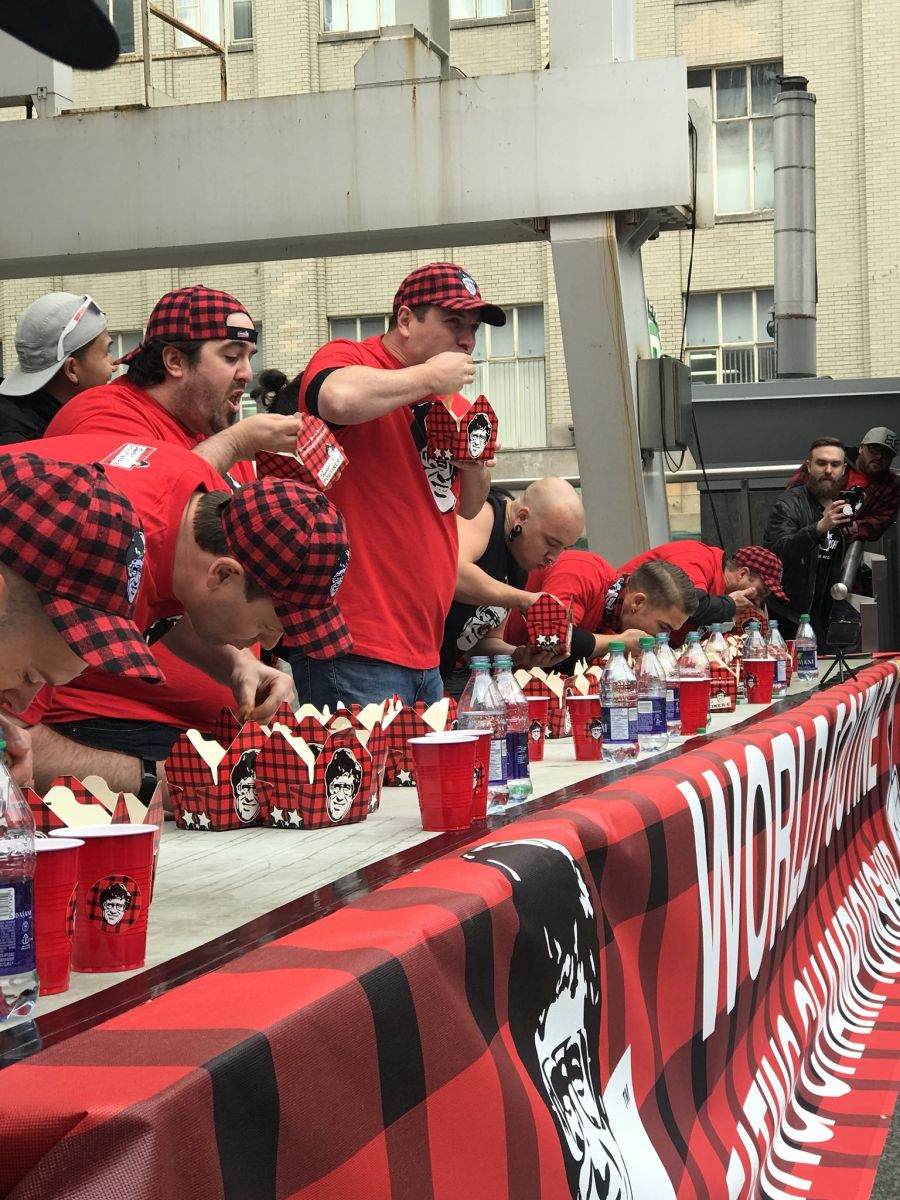 <who>Photo Credit: Smoke's Poutinerie</who>Dan Audy competes in the amateur division of the WPEC. He's at the end of the table with the hat and long black sleeves.