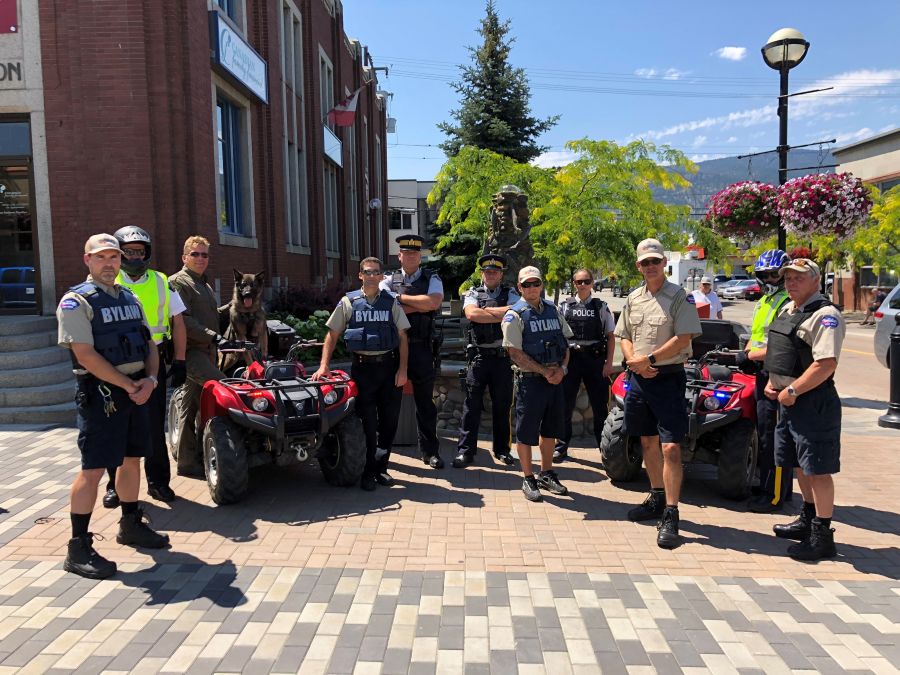 <who>Photo Credit: Contributed </who>Members of the Penticton RCMP, including Supt. Ted de Jager, and members of the City of Penticton's bylaw enforcement team gathered for a photo Thursday afternoon in Nanaimo Square. The City issued a news release saying it is adopting a 'zero tolerance' policy on illegal activity, including people who drink alcohol and consume drugs in public places and other who occupy and abuse public and private property.