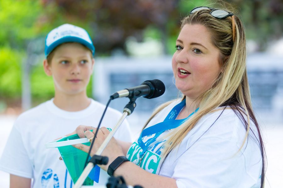 Jodie Conti with son Tyson announcing raffle prize winners