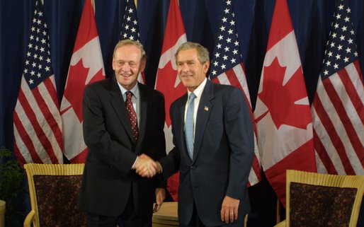 <who> Photo credit: The White House </who> Chretien with George W Bush in 2002.